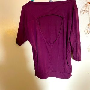 Short sleeve active wear top. Open back.